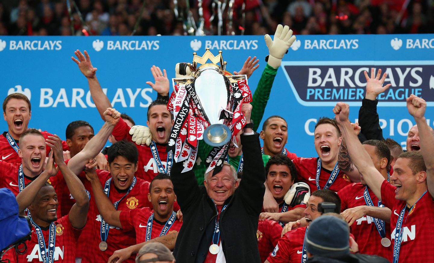 Sir Alex Ferguson lifts the Premier League trophy in May 2013
