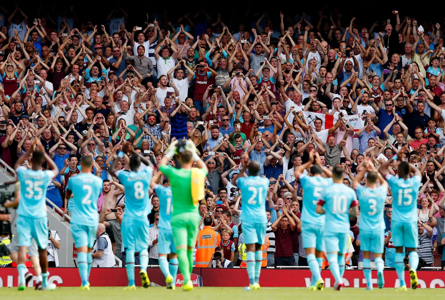 West Ham players applaud their fans after a win against Arsenal at Emirates Stadium