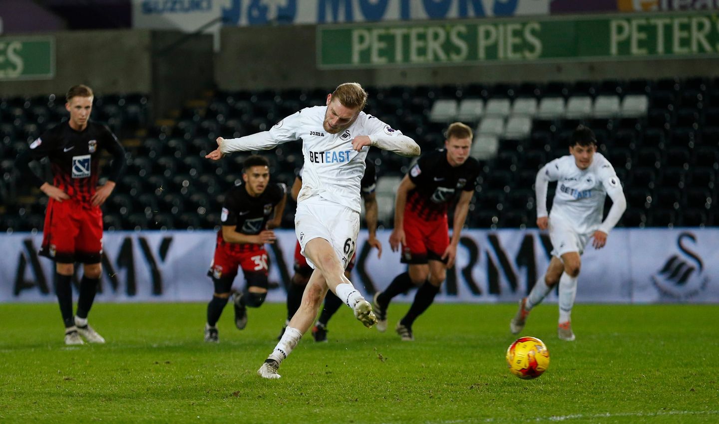 Oli McBurnie scores for Swansea in the Checkatrade Trophy
