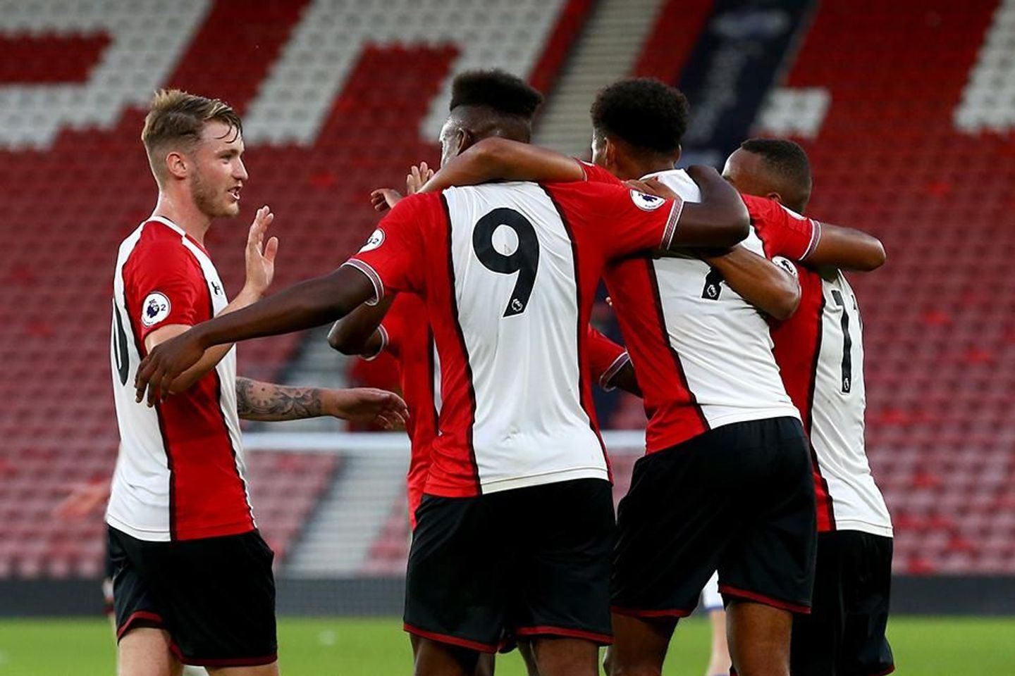 Jonathan Afolabi celebrates his PL2 goal with team-mates