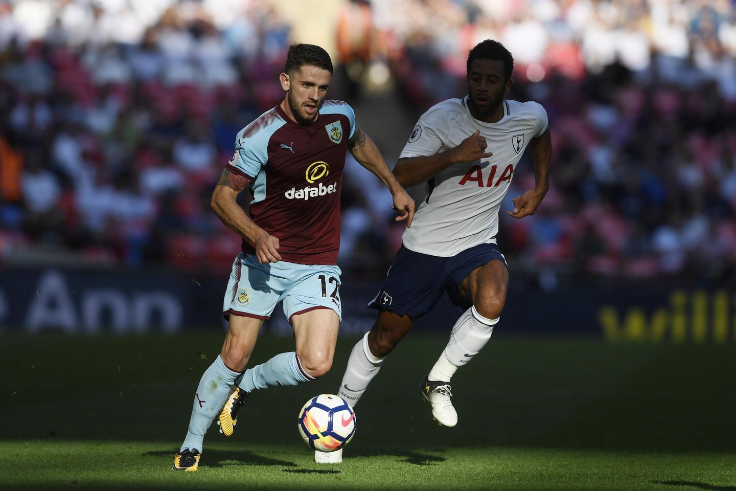 Burnley's Robbie Brady drives forward with the ball against Tottenham Hotspur