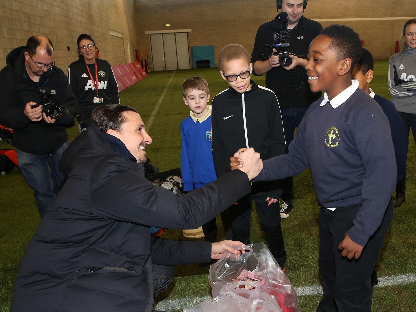Shia from St Alphonsus RC Primary School meets Zlatan Ibrahimovic at Aon Training Complex.jpg