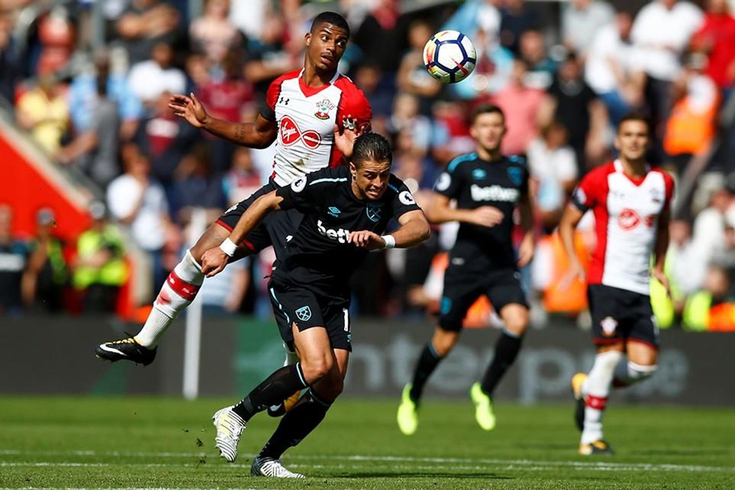 Southampton's Mario Lemina battles with West Ham's Chicharito