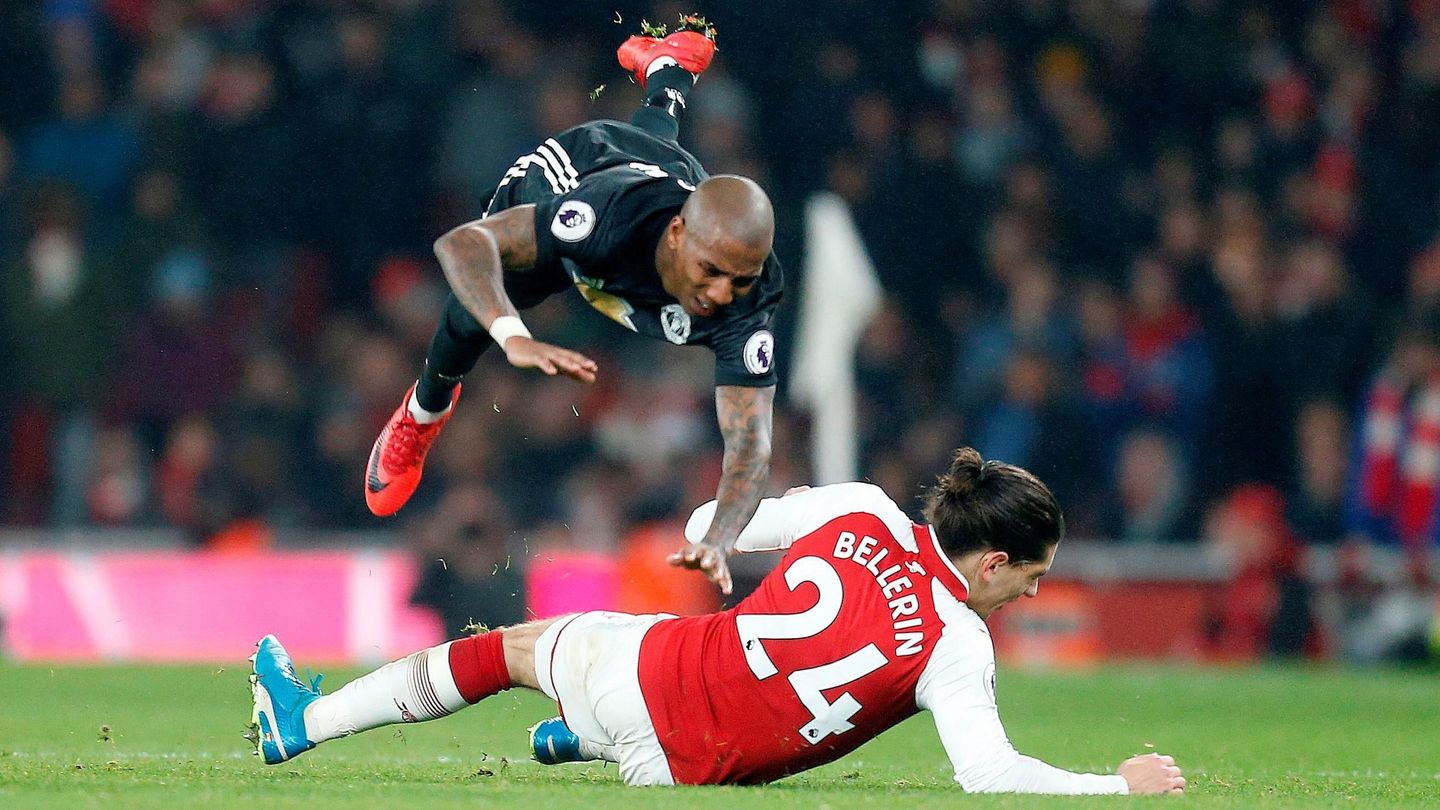 Hector Bellerin tackles Ashley Young