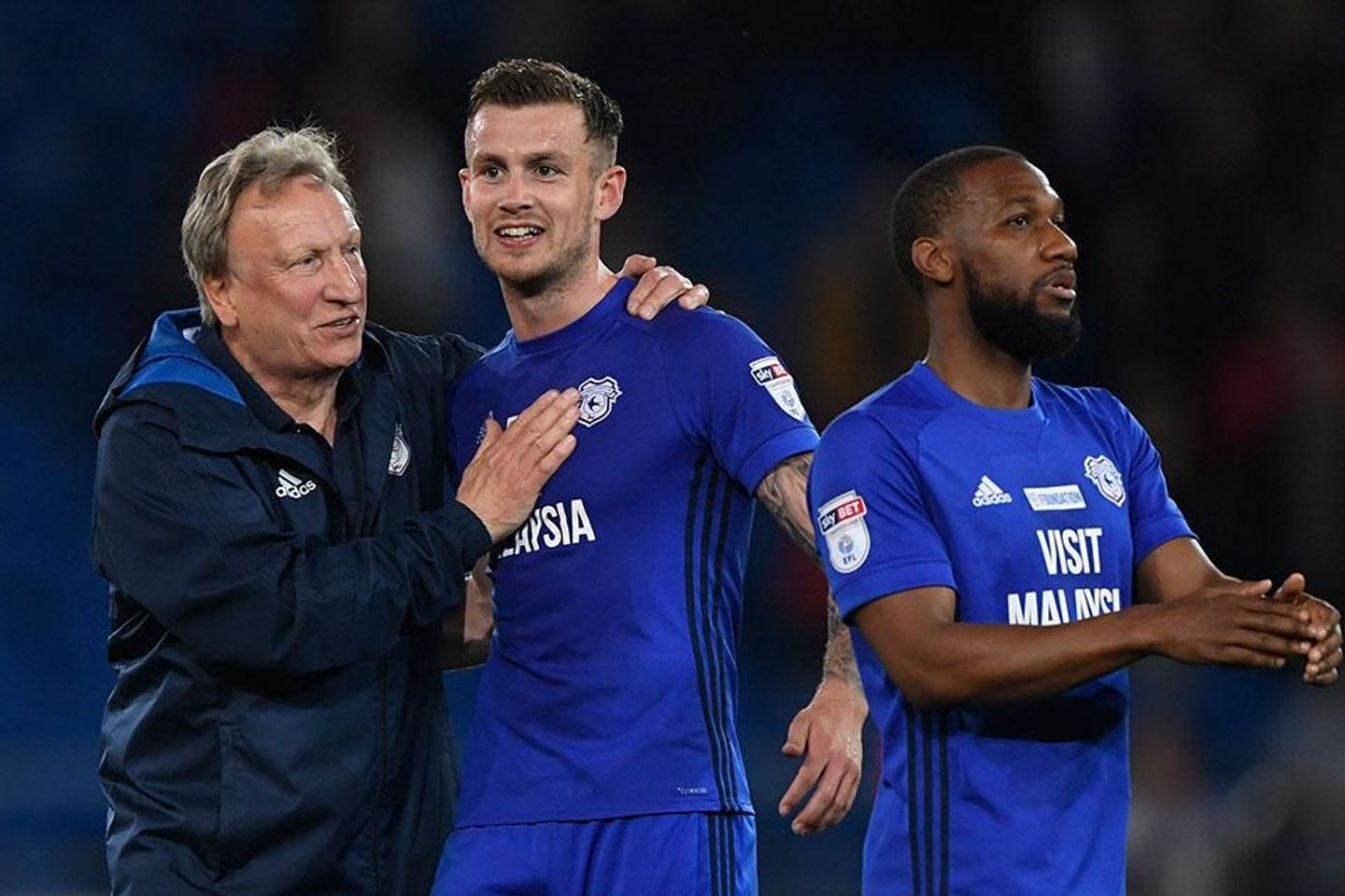 Neil Warnock, Joe Ralls, and Junior Hoilett, of Cardiff City