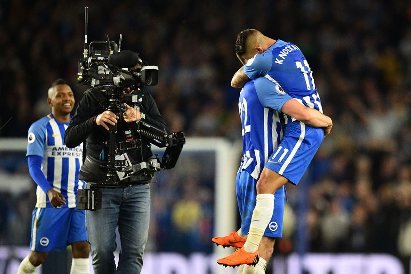 Brighton's players celebrate in front of the camera