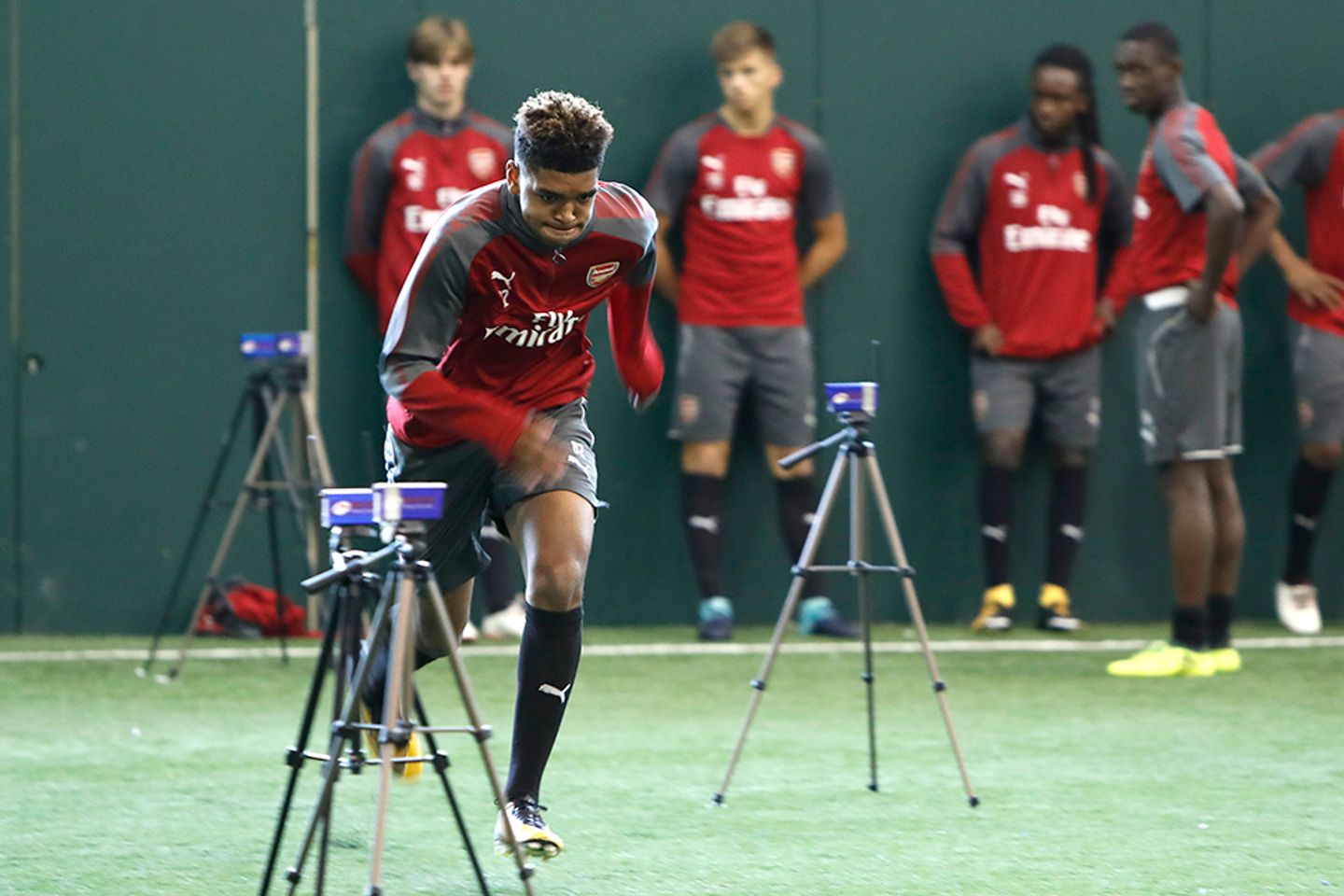 An Arsenal player sprints in a training session