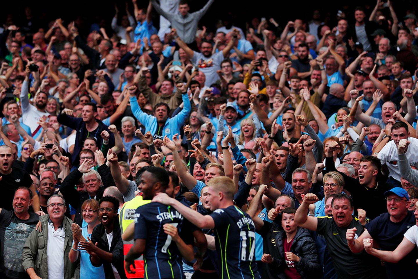 Man City fans celebrate v Arsenal