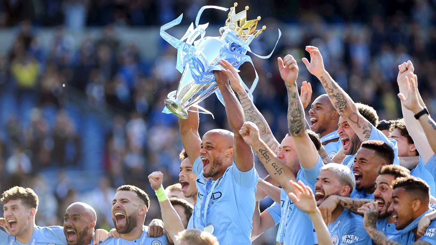 Vincent Kompany lifts the Premier League Trophy