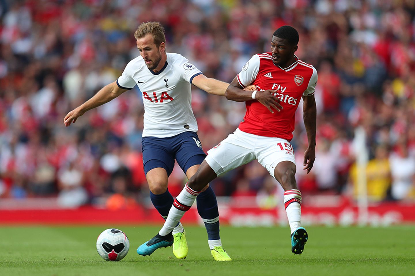Spurs' Harry Kane in action against Arsenal's Ainsley Maitland-Niles