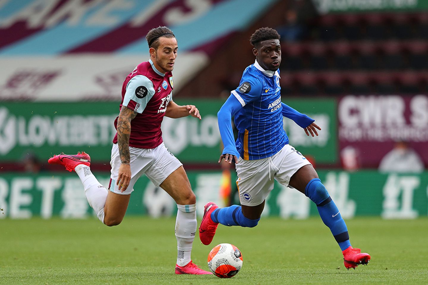 Brighton's Yves Bissouma (right) takes on Burnley's Josh Brownhill (left)