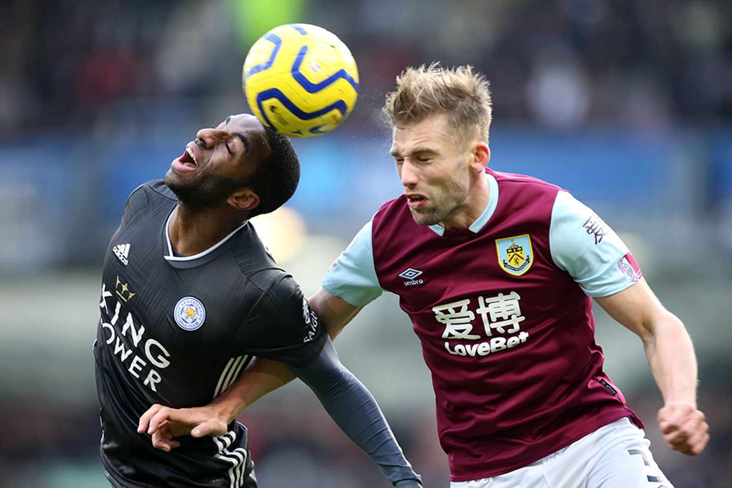 Charlie Taylor of Burnley competes against Leicester's Ricardo Pereira