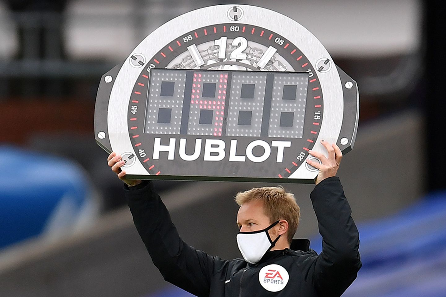 Fourth official puts up the board for a substition