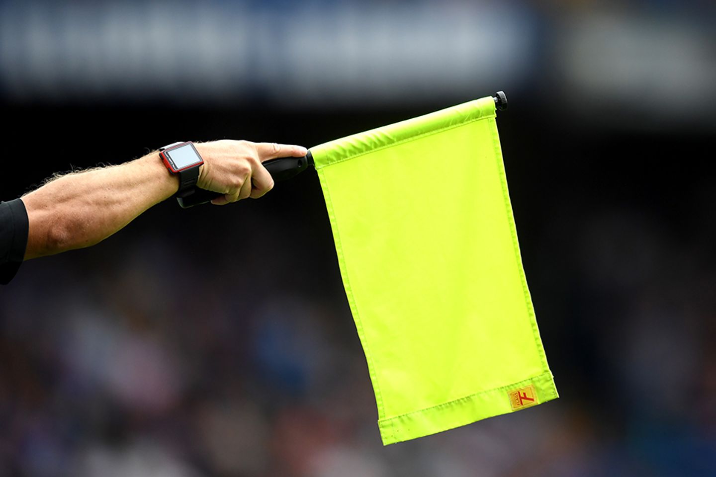 An assistant referee flags for offside