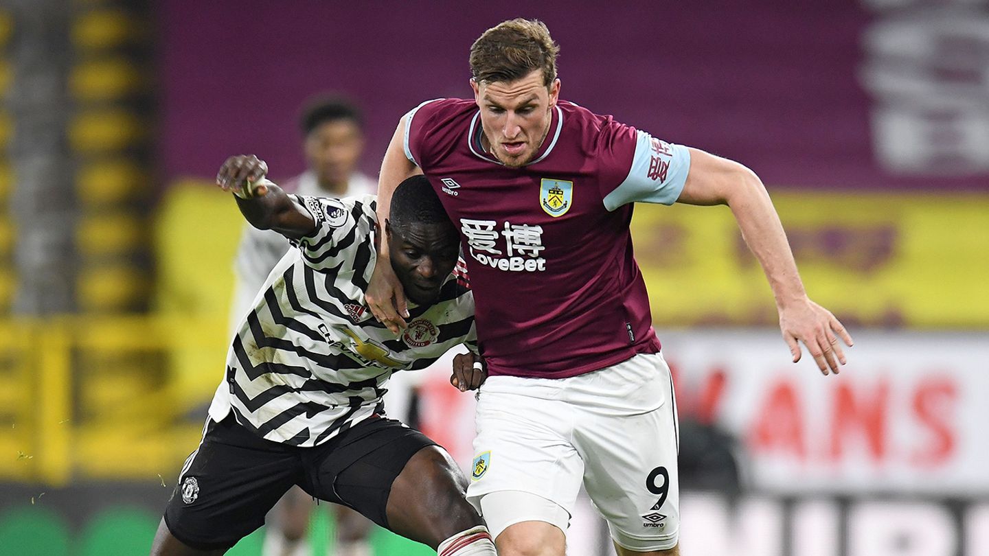 Eric Bailly competes against Chris Wood