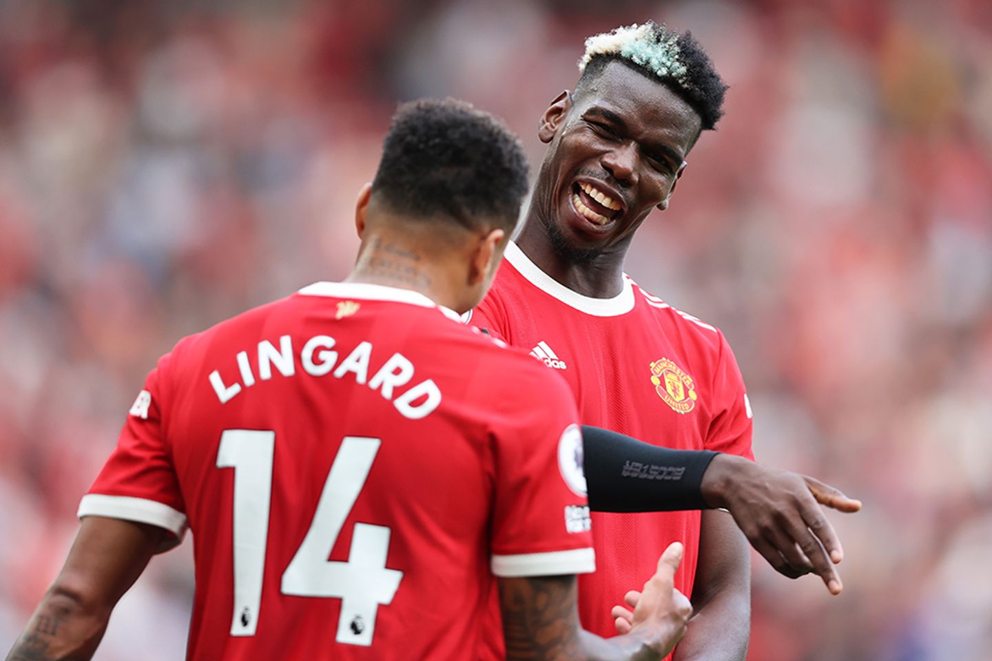 Paul Pogba celebrates with Jesse Lingard