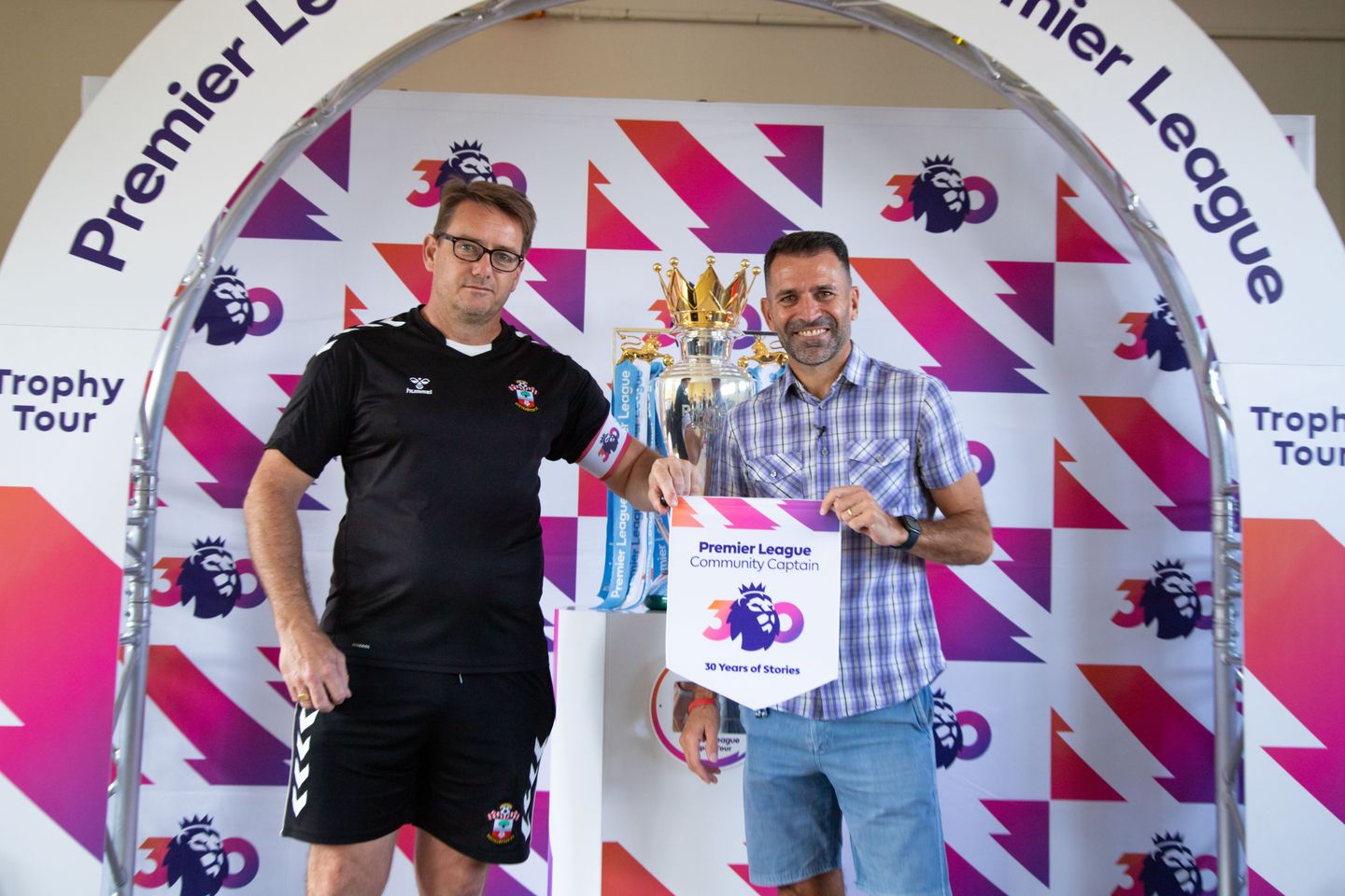 Saints Foundation Paul Hedges receives his Community Captain armband from Francis Benali
