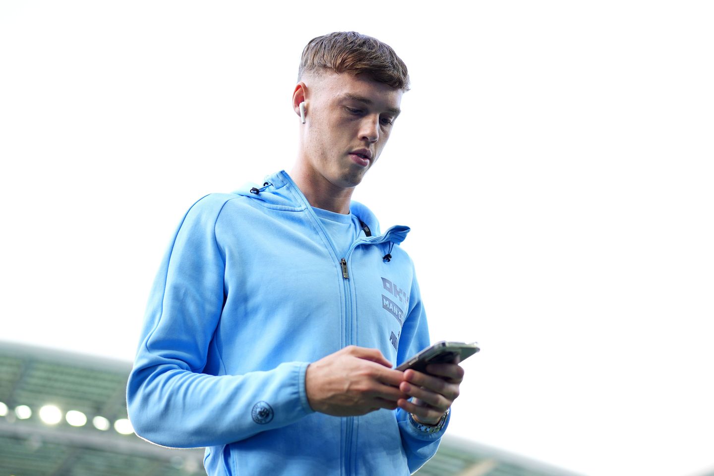 Cole Palmer checks his phone