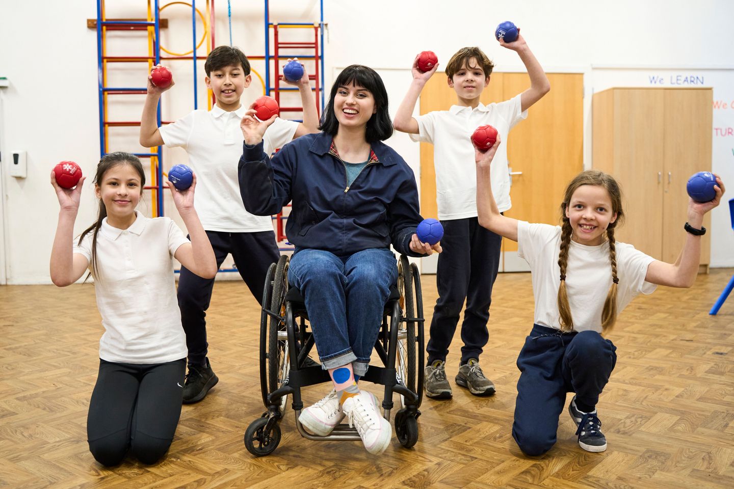 Super Movers 2024- Group holding boccia balls with Abby Cook