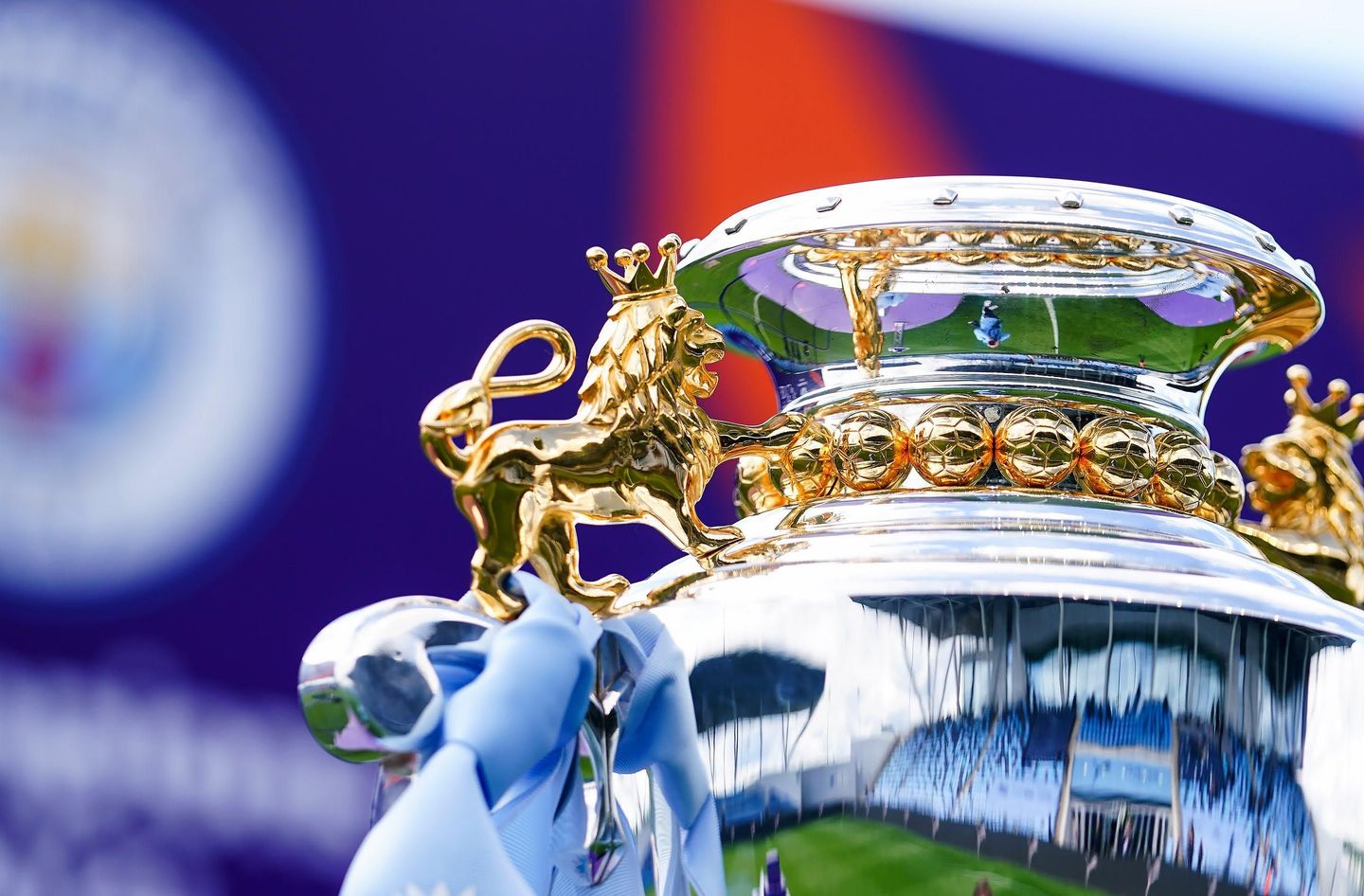 PL2 Trophy with Man City ribbons close-up