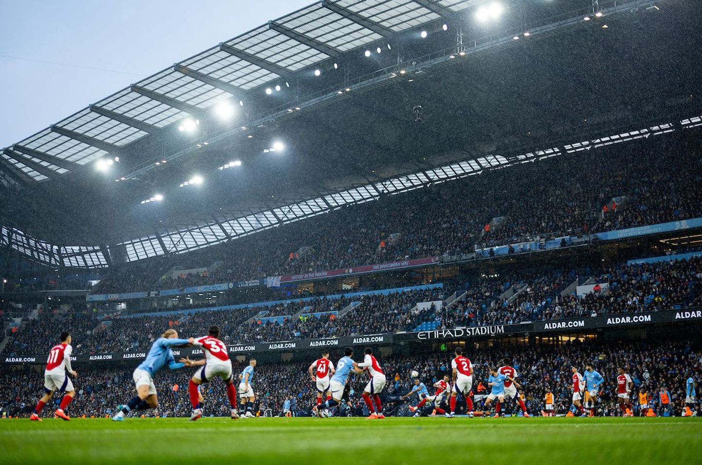 5. Man City and Arsenal players get to grips at the Etihad Stadium