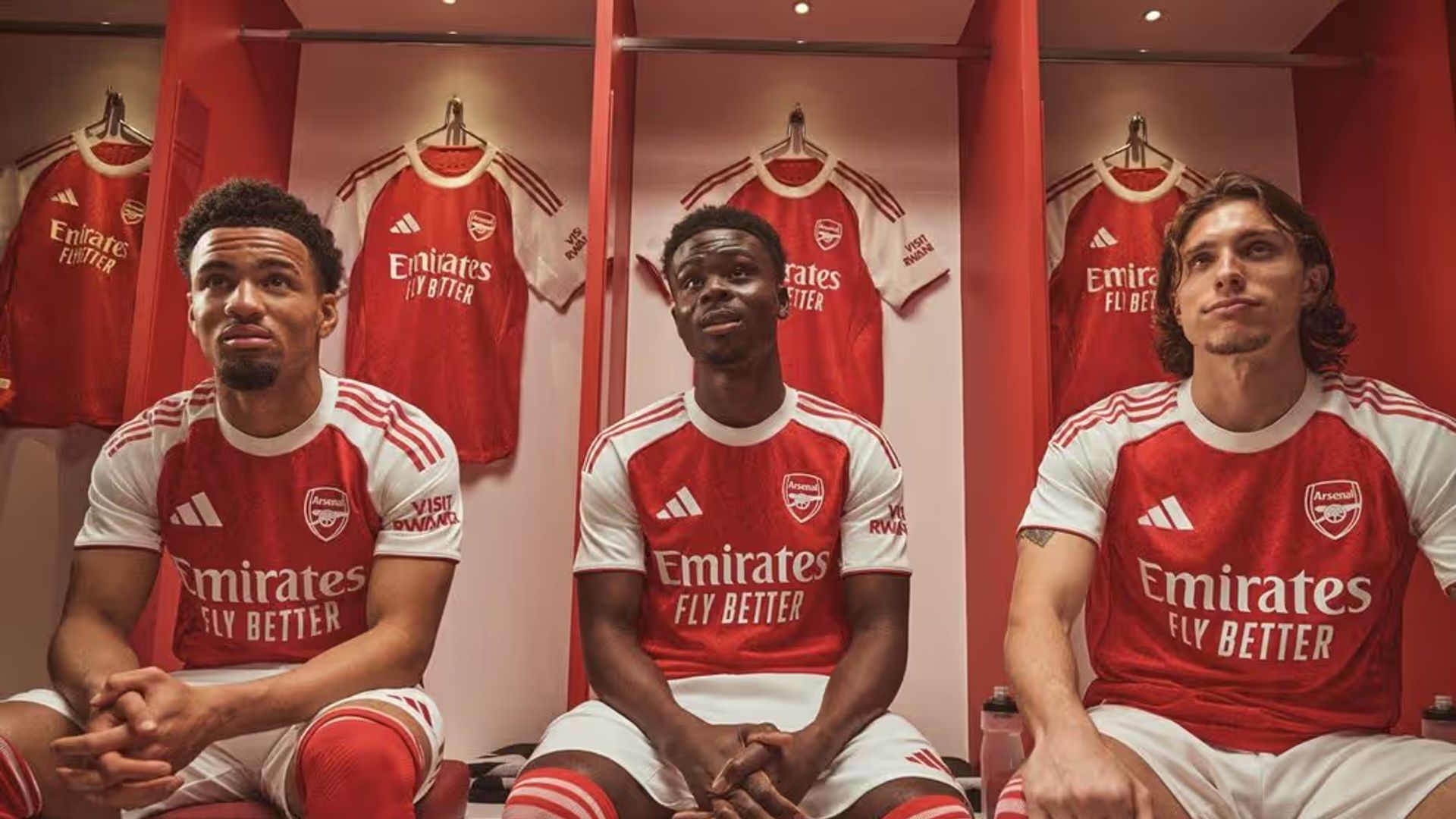 Ethan Nwaneri, Bukayo Saka and Riccardo Calafiori in Arsenal's home kit