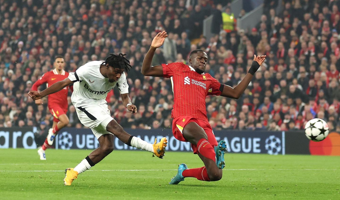 Jeremie Frimpong shoots for Bayer Leverkusen at Liverpool in the UEFA Champions League