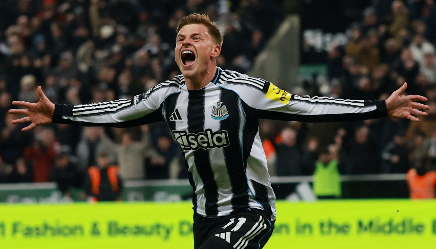 Harvey Barnes, with his arms outstretched, wheels away after scoring against Man City