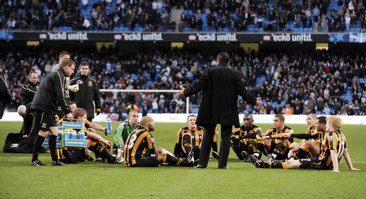 Phil Brown's half-time team talk on the pitch at Manchester City