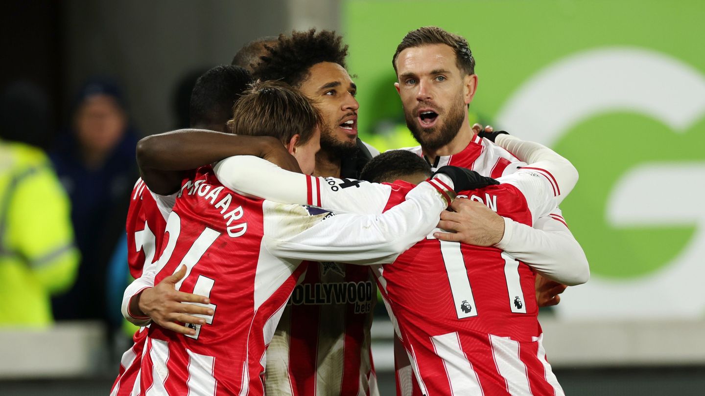 Schade celebrating with teammates after scoring hat-trick v Bournemouth