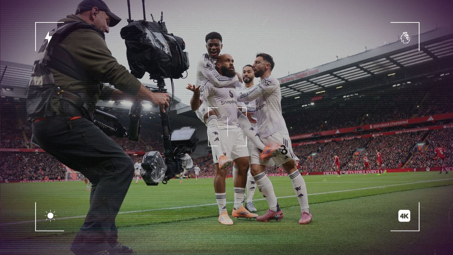 Camera catches the cameraman catching Man Utd celebrating at Anfield