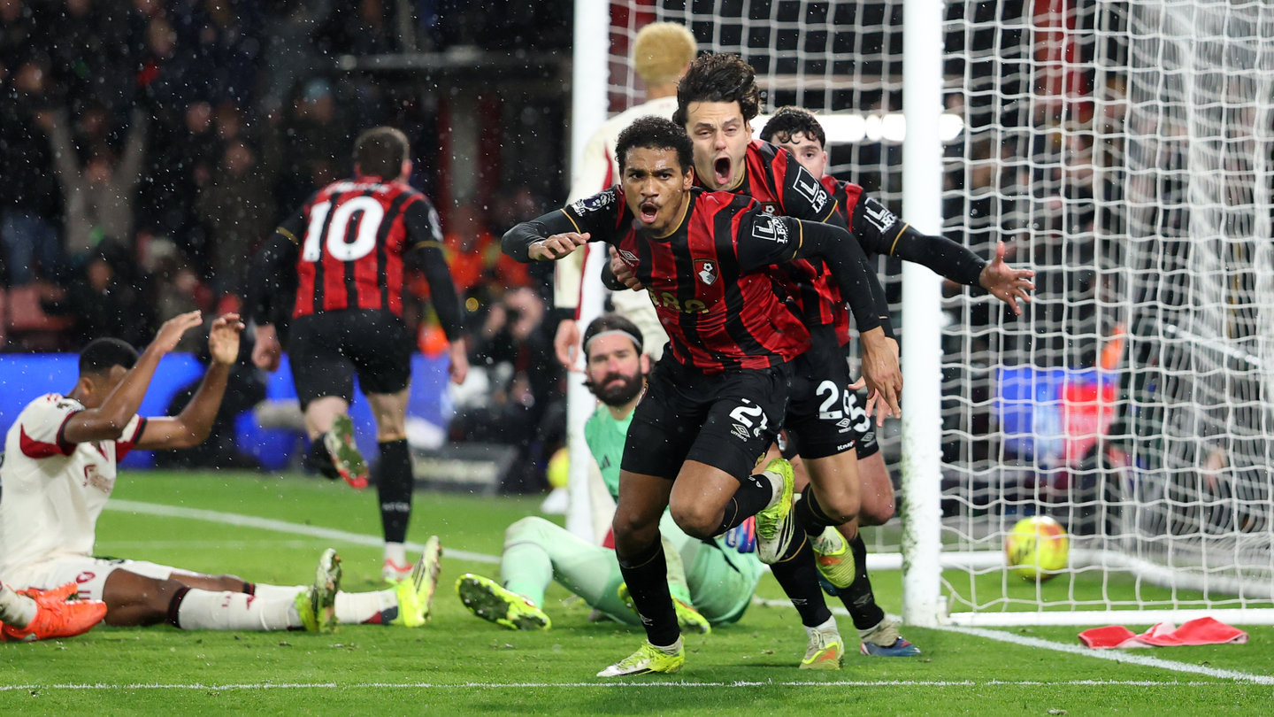 Amine Adli celebrates his winning goal for Bournemouth against Liverpool as his team-mates pursue him