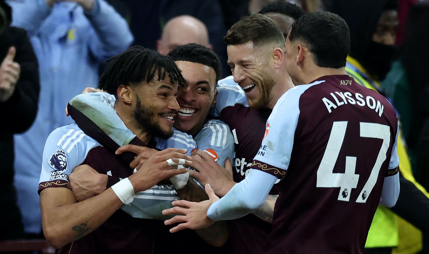 Tyrone Mings (left) celebrates Villa's winner against Brighton