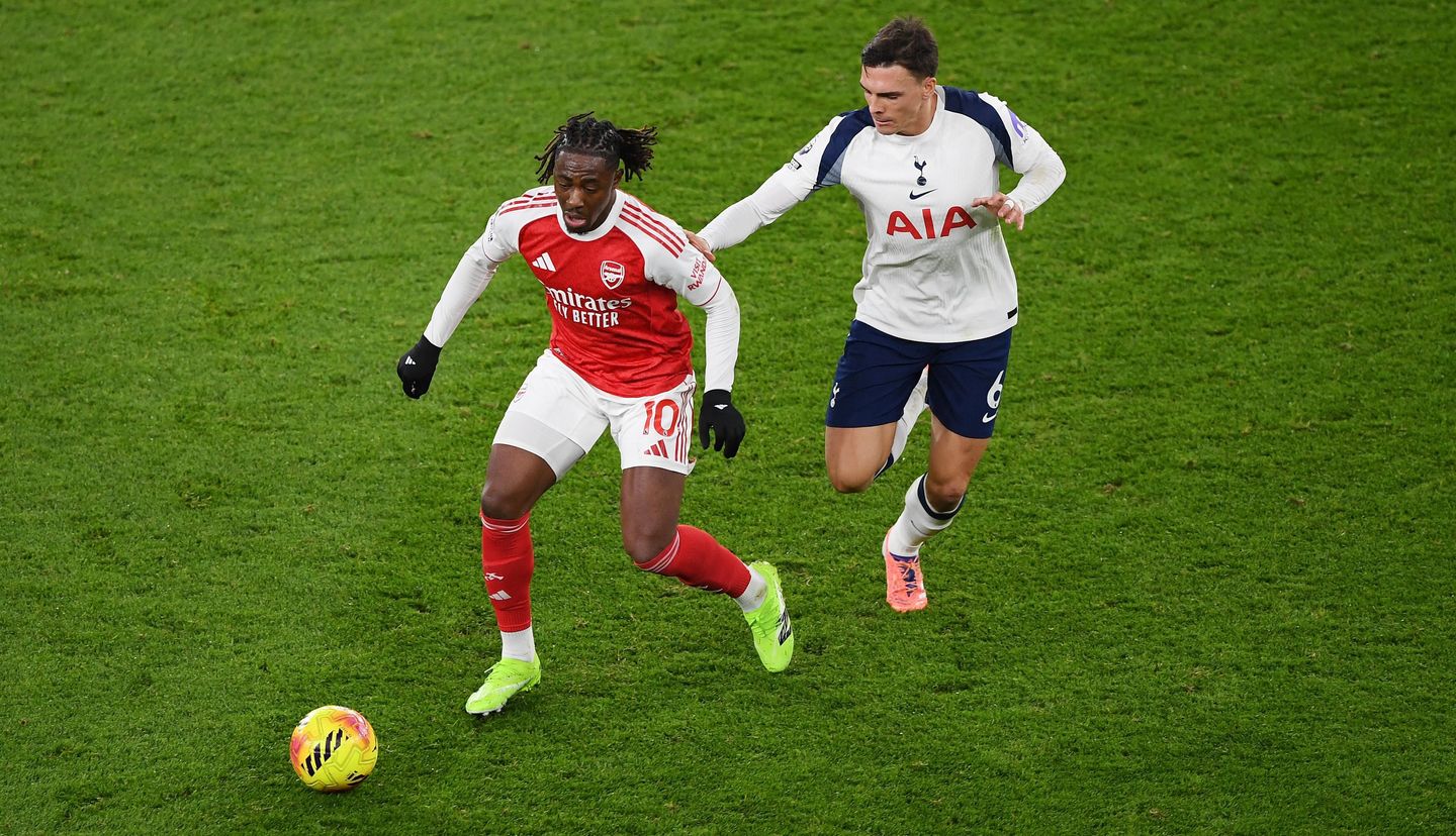 Eberechi Eze of Arsenal (left) is challenged by Tottenham Hotspur's Joao Palhinha (right)