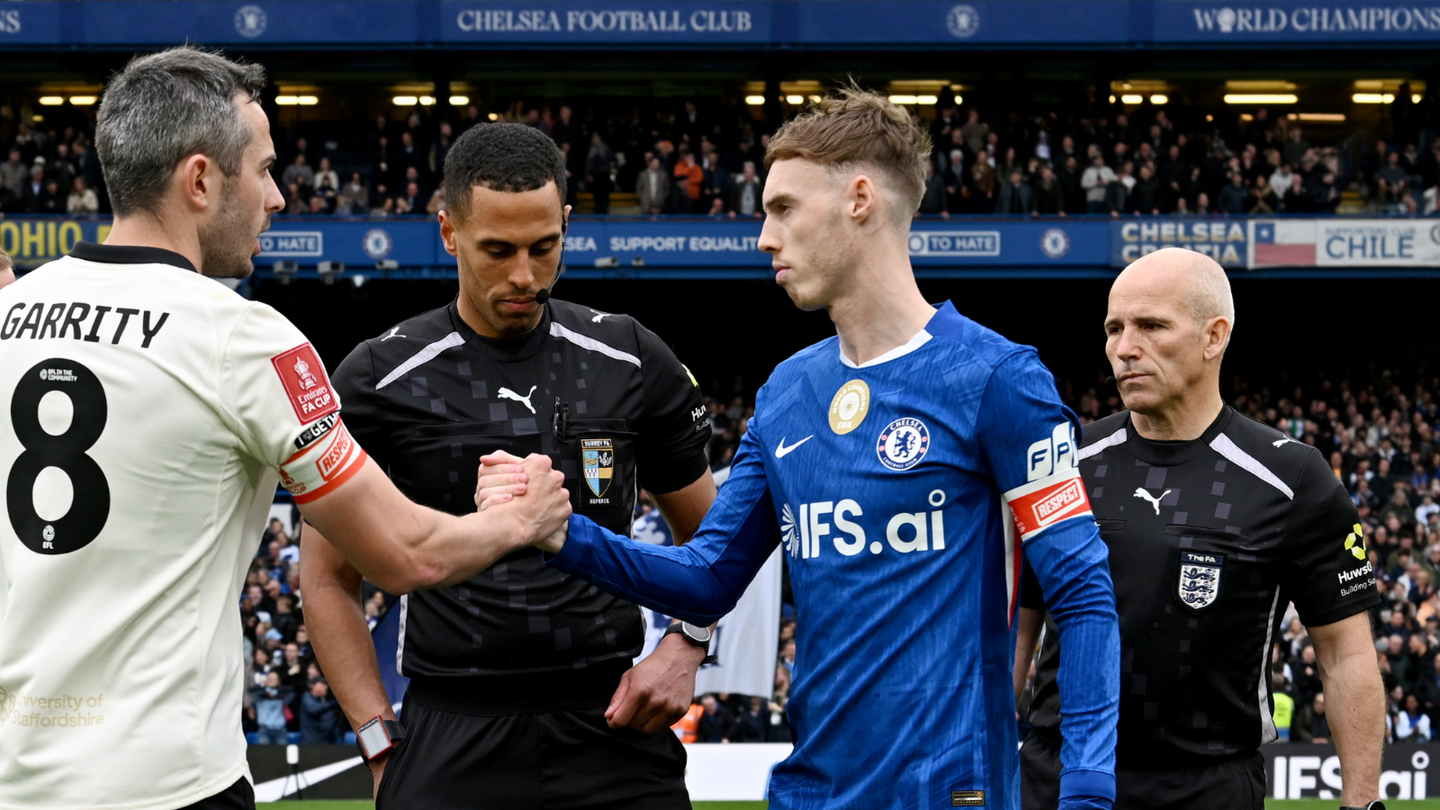 Cole Palmer as Chelsea captain shakes hands with Port Vale captain Ben Garrity in front of match referee Farai Hallam