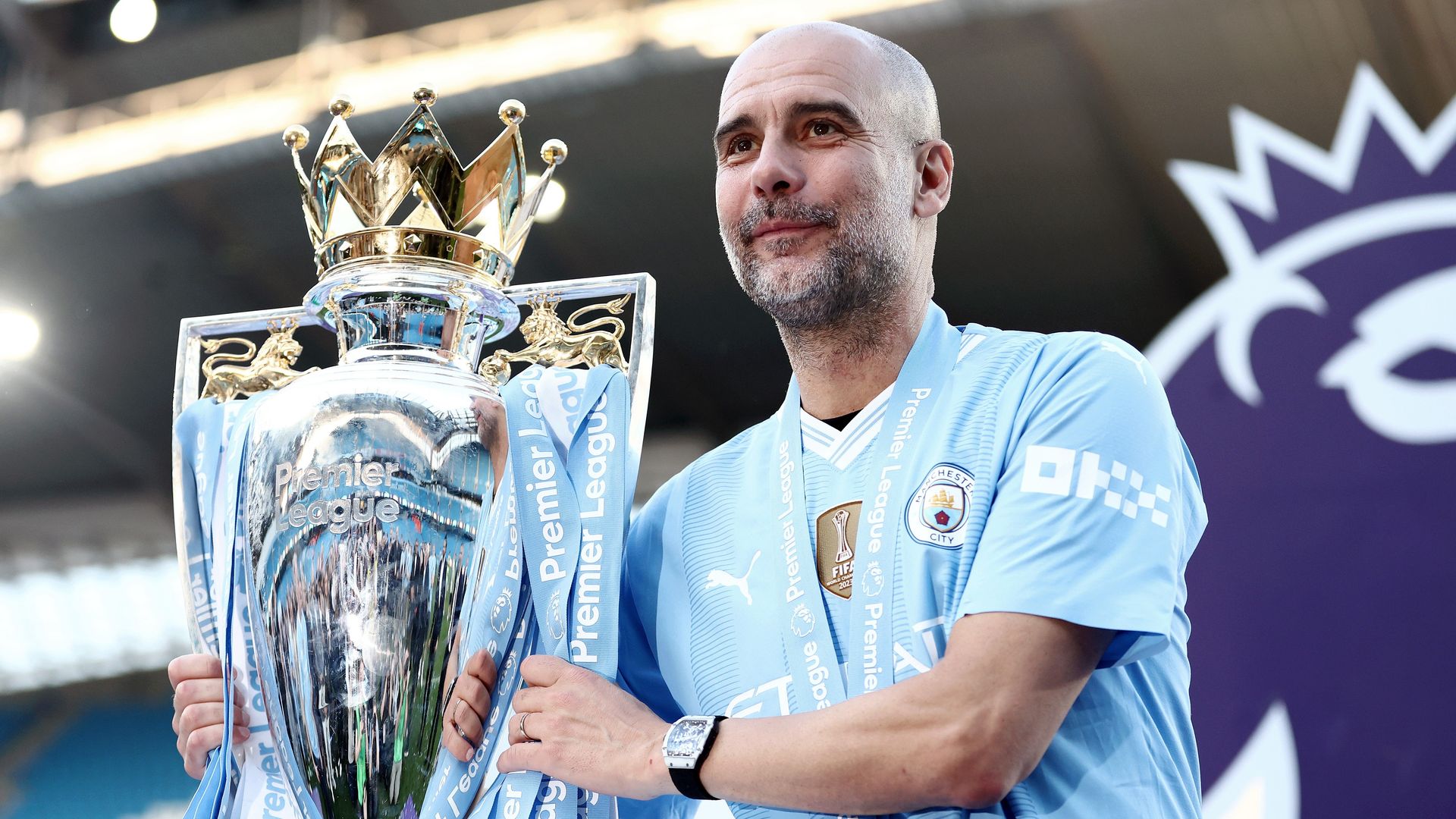 Pep Guardiola with the Premier League Trophy