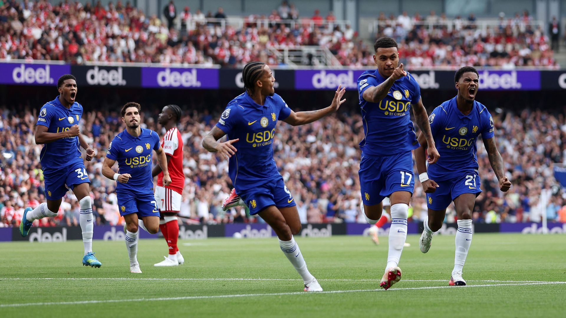 Chelsea celebrate their early goal against Arsenal